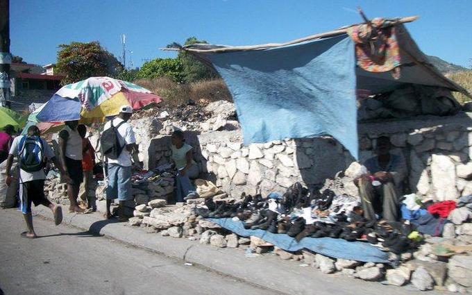 selling shoes under a tarp